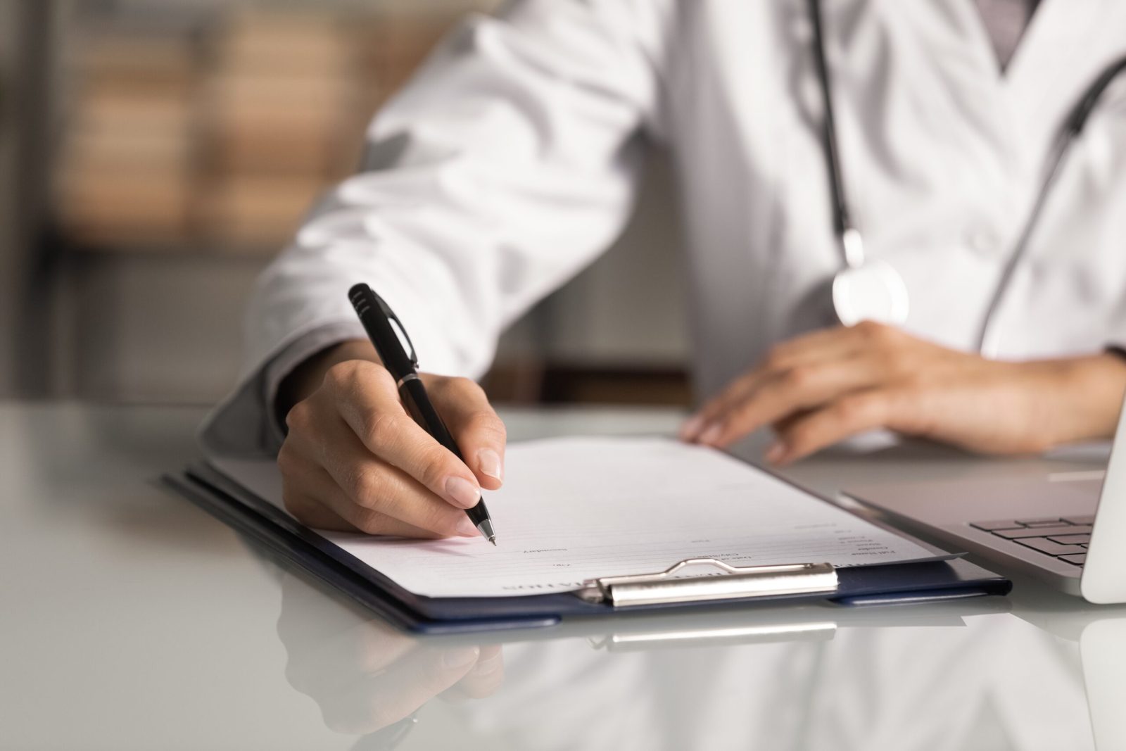 Hands,Of,General,Practitioner,Filling,Paper,Medical,Records.,Doctor,In